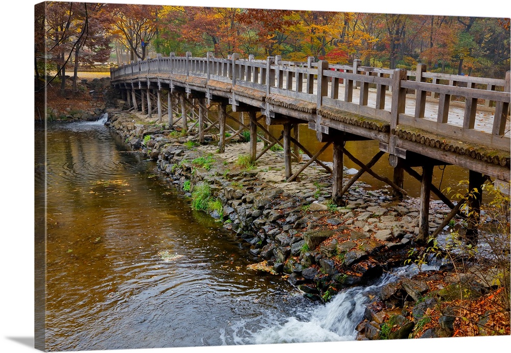 Wood bridge and autumn color at namsangol traditional folk village, seoul, South Korea.