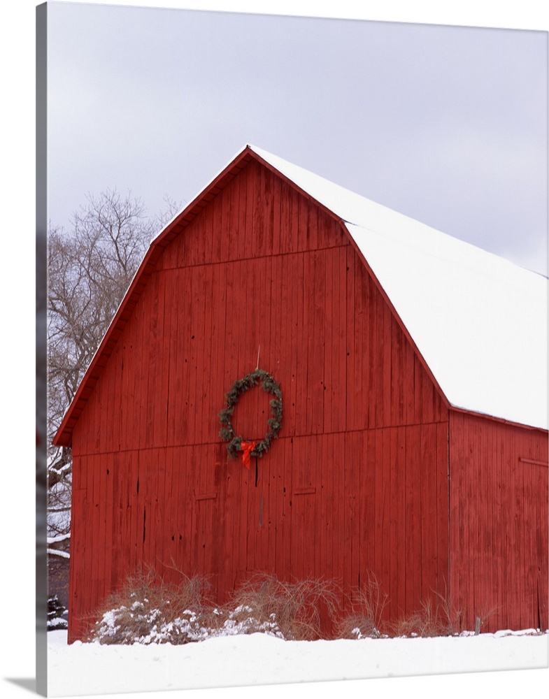 Big photo on canvas of a farm building decorated for Christmas in the snow.