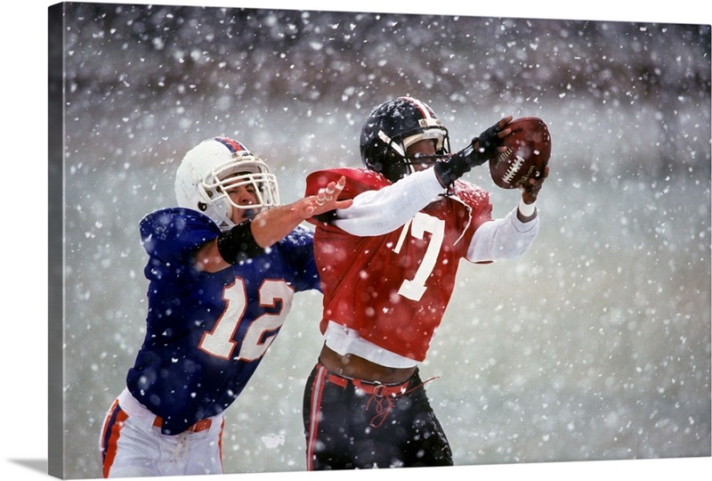 American football player reaching for the ball | Great Big Canvas