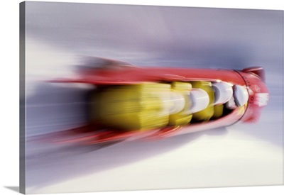 Blurred action of 4 man bobsled team