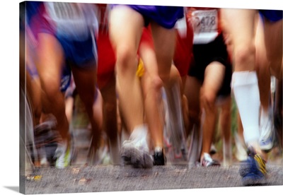 Blurred action of runner's legs competing in a race