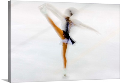 Blurred action of woman figure skater