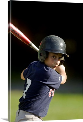 Boy batting during baseball game