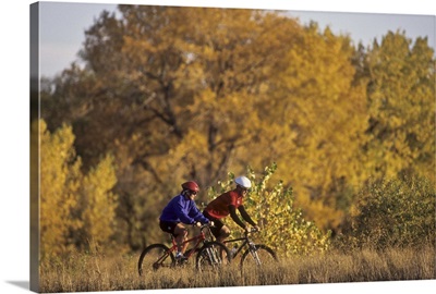 Couple mountain biking in Fall