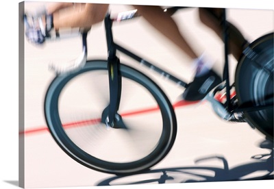 Detail of blurred action of cyclist competing on the velodrome