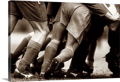Detail of feet of a group of rugby players in a scrum