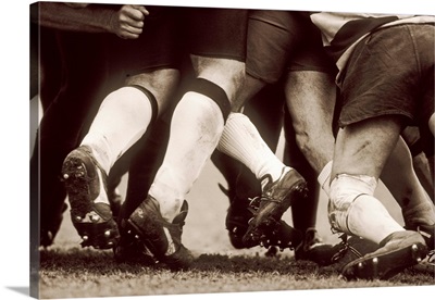 Detail of the feet of a group of ruby players in a scrum