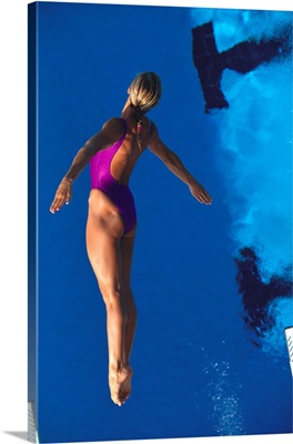 Female diver in action off the springboard