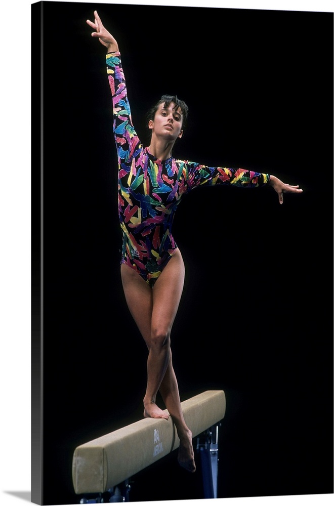 Female gymnast on the balance beam