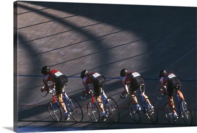 Male cycling team on the velodrome