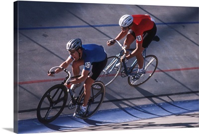 Male cyclists competing on the velodrome