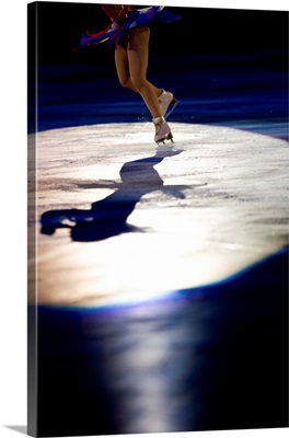 Shadow of female figure skater in action