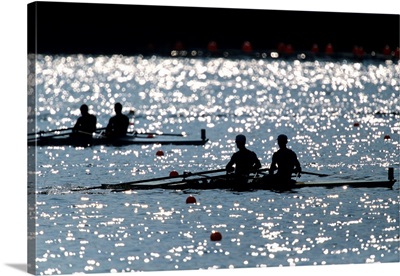 Silhouette of men's pairs rowing teams in action