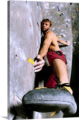 Wall climber placing his foot