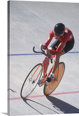 Woman cyclist competing on the velodrome