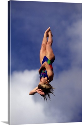 Woman diver flying through the air