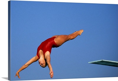 Woman diver flying through the air