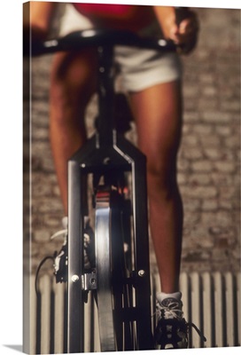Woman exercising on a stationary bike