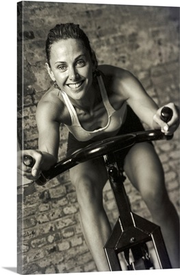 Woman exercising on a stationary bike.
