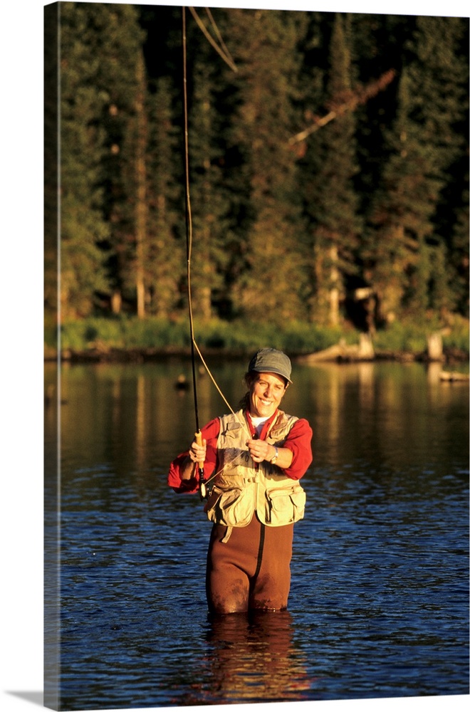 Woman fly fishing Solid-Faced Canvas Print