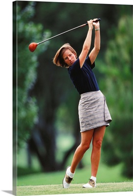 Woman golfer in action