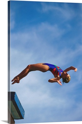 Young girl diving off the 10m platform