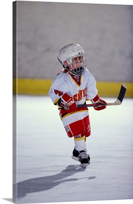 Young ice hockey player in action