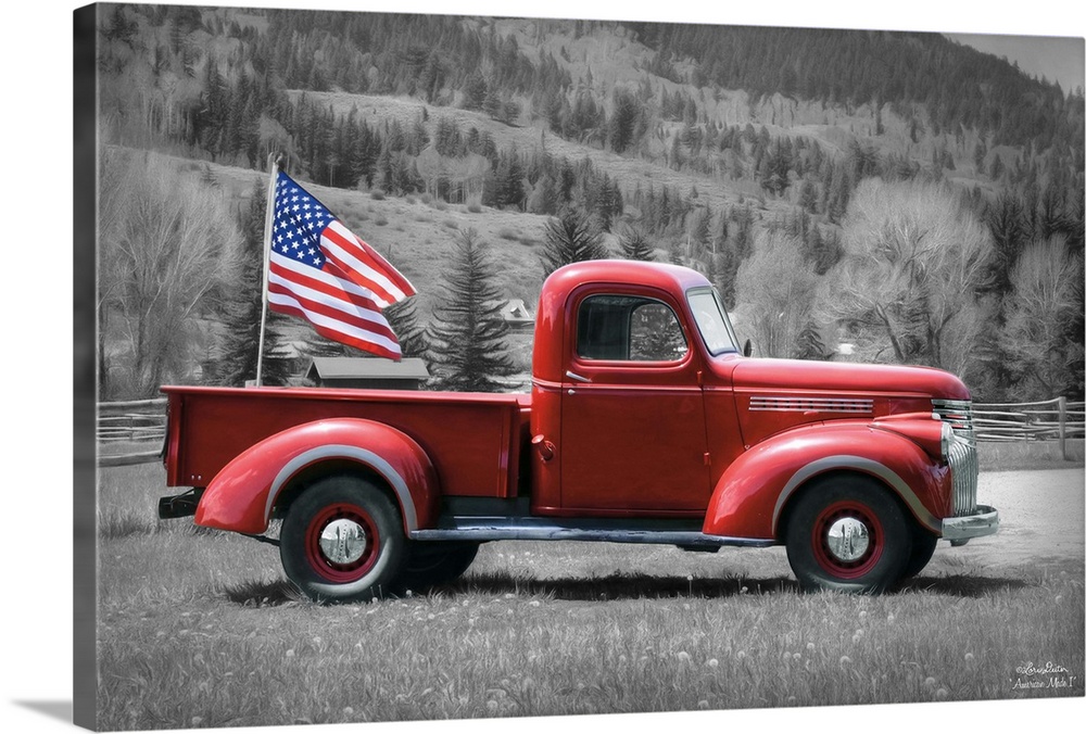 Photograph of a red vintage truck with an American Flag waving in the back.