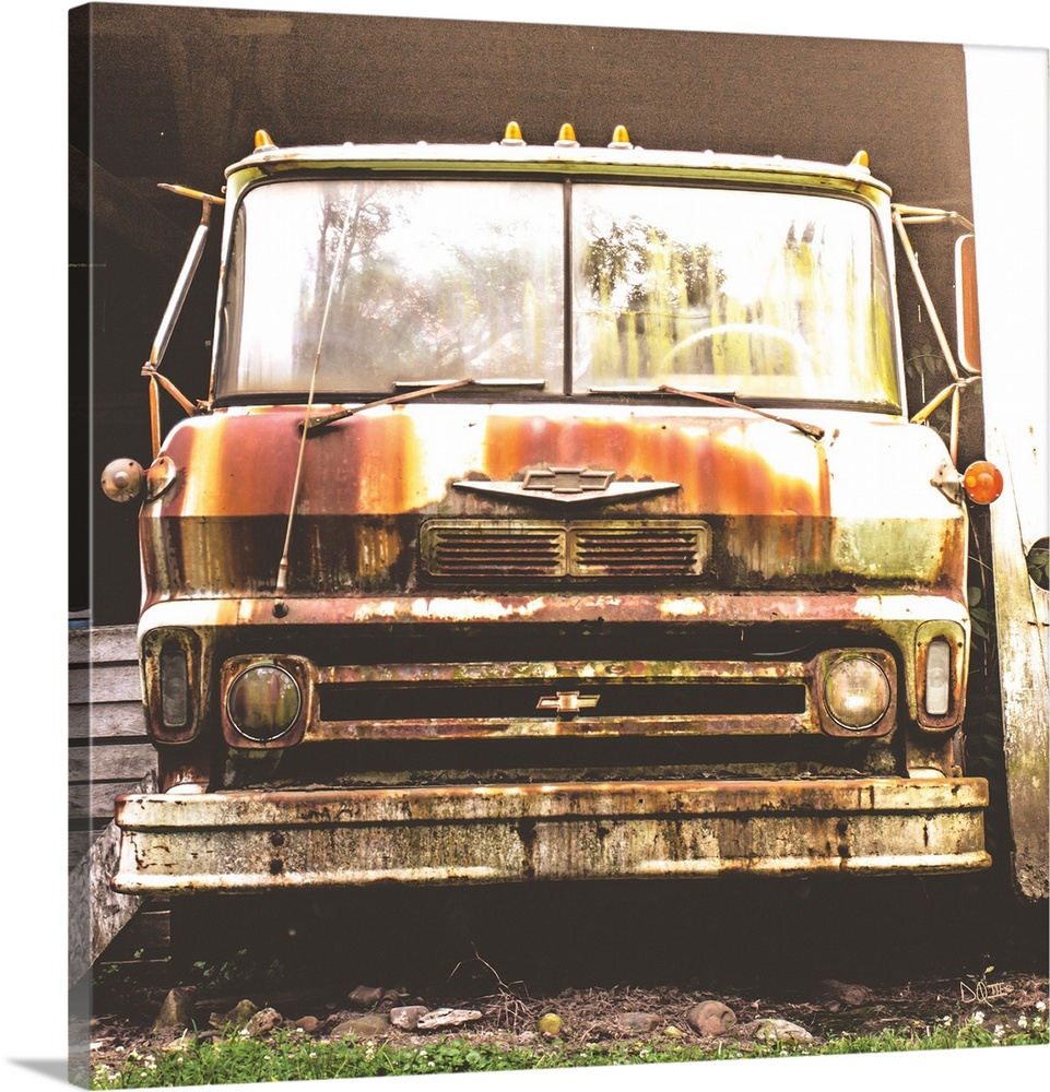 Photograph of a rusted and abandoned Chevrolet truck.
