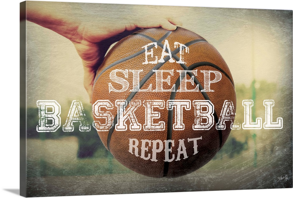 A basketball typography design with a hand holding a ball.