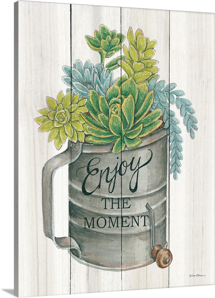 The words, Enjoy the moment, are placed over an aged flour sifter filled with vibrant succulents over a white planks.