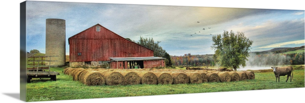 Photograph of a red barn in rural countryside scene.