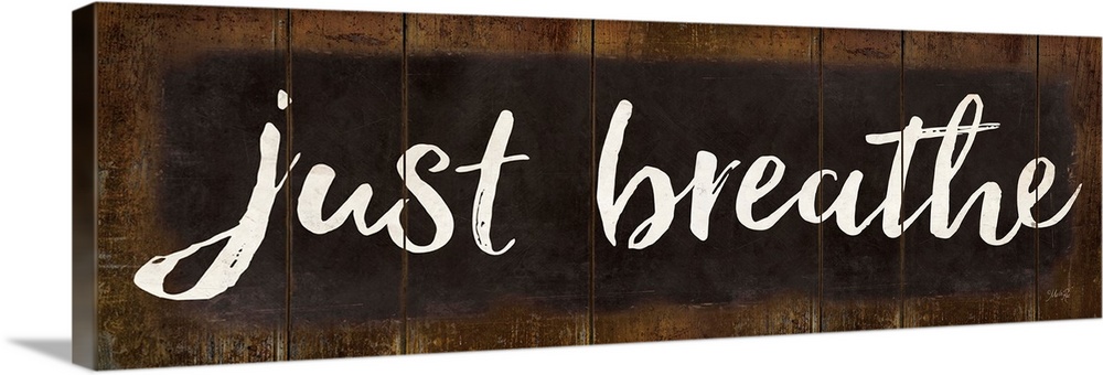 "Just Breathe" in white handlettered script on a weathered brown background.