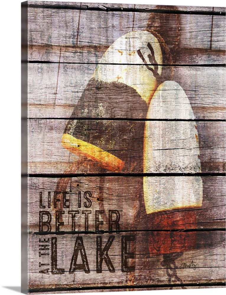 Decorative artwork featuring the words, Life is better at the lake, over a wood plank texture and fishing bobs in the back...