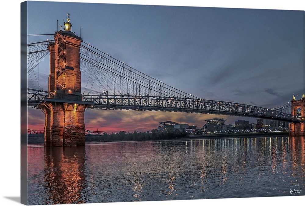 The John A. Roebling Suspension Bridge over the Ohio River in the early evening.