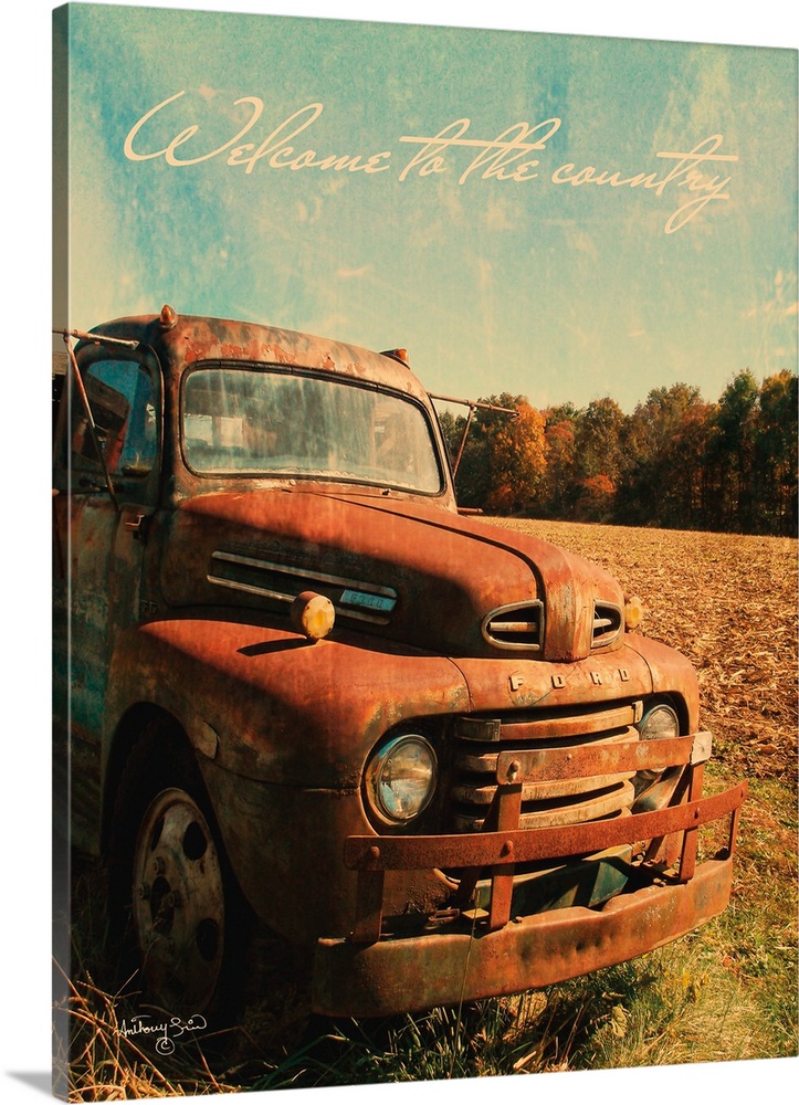 The words: Welcome to the country, are placed over rusted pick-up truck with distressing throughout.