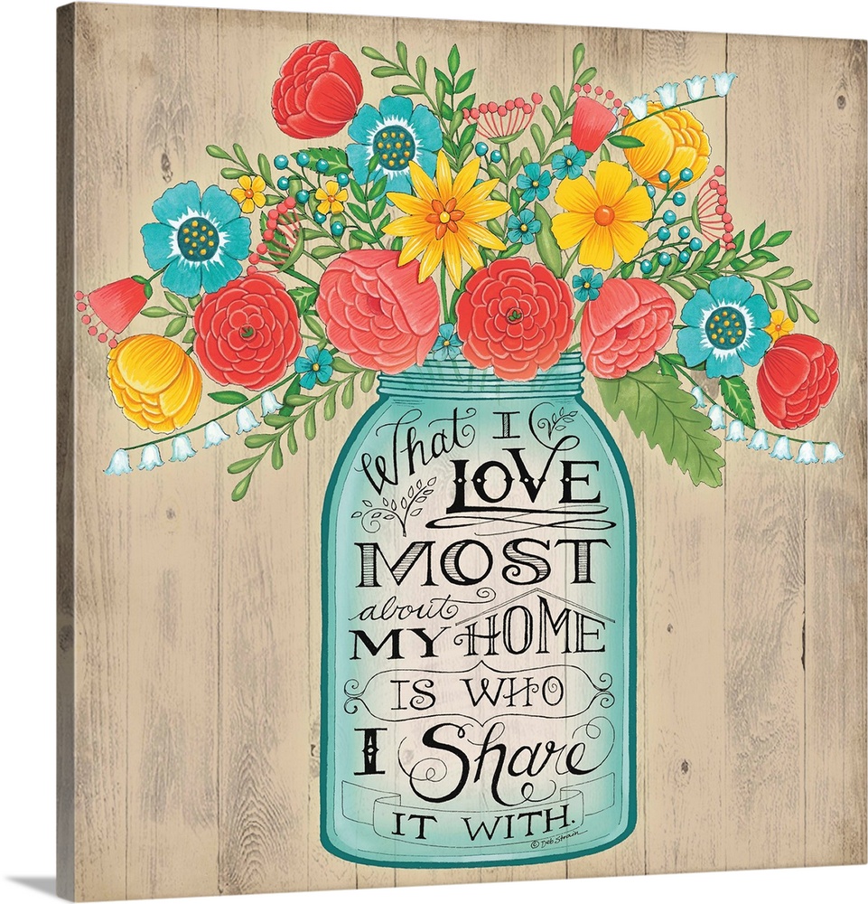 A bouquet of colorful flowers in a mason jar with decorative lettering.