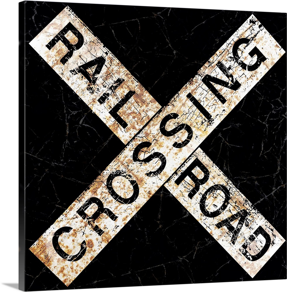 A worn, distressed, cracked and rusty Railroad Crossing street sign.