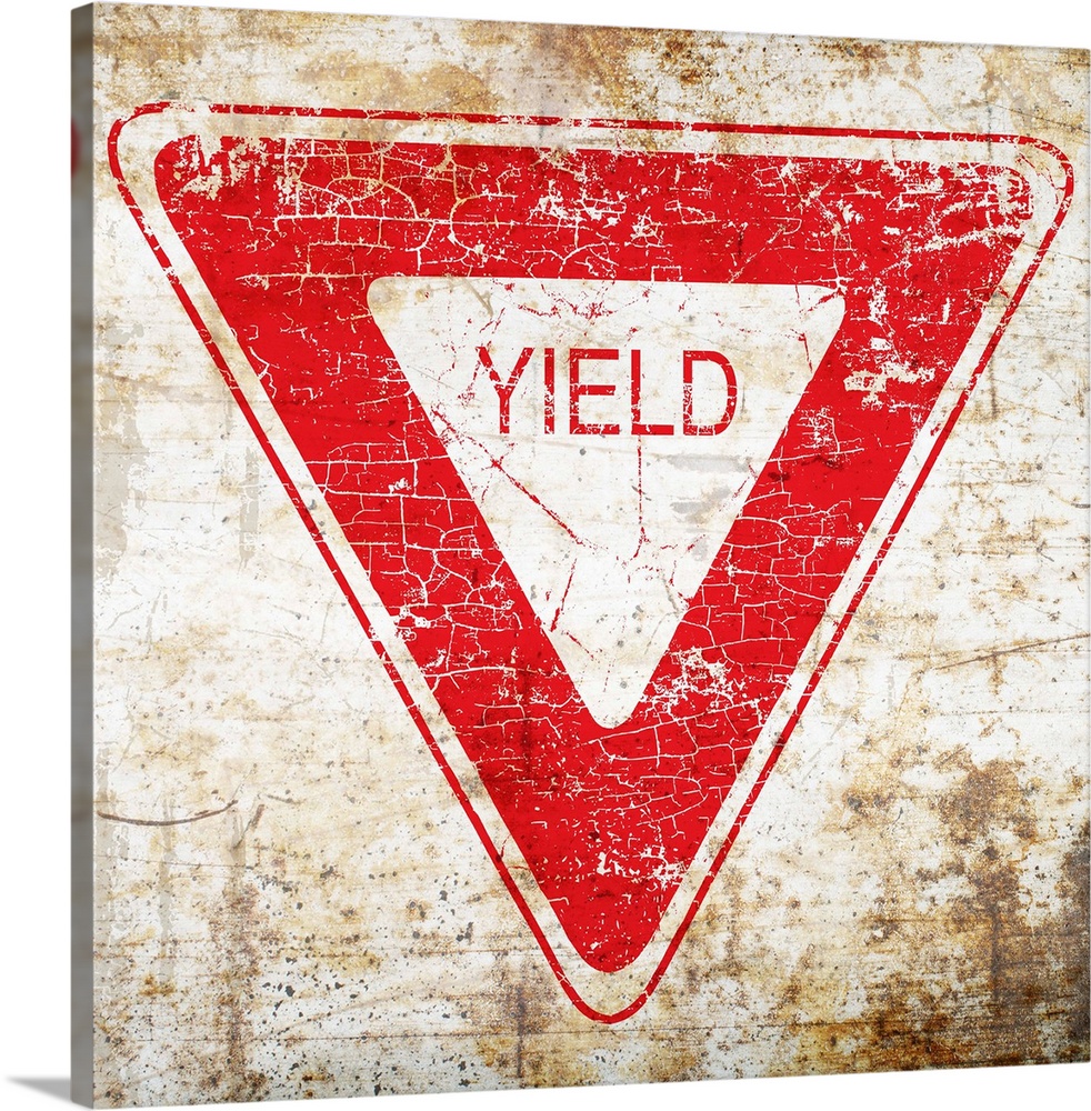 A worn, distressed, cracked and rusty Yield street sign.