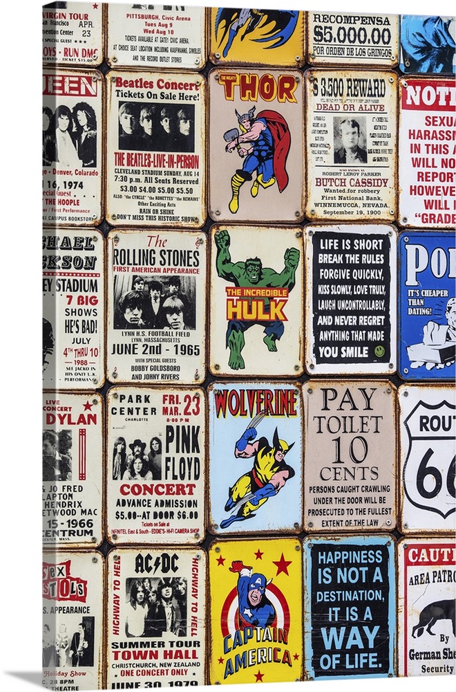 Souvenir metal signs for sale in London, featuring superheroes, sarcastic sayings, and popular music artists.