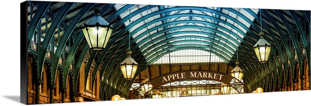 Panoramic image of the arches and hanging lamps in Covent Garden Market.