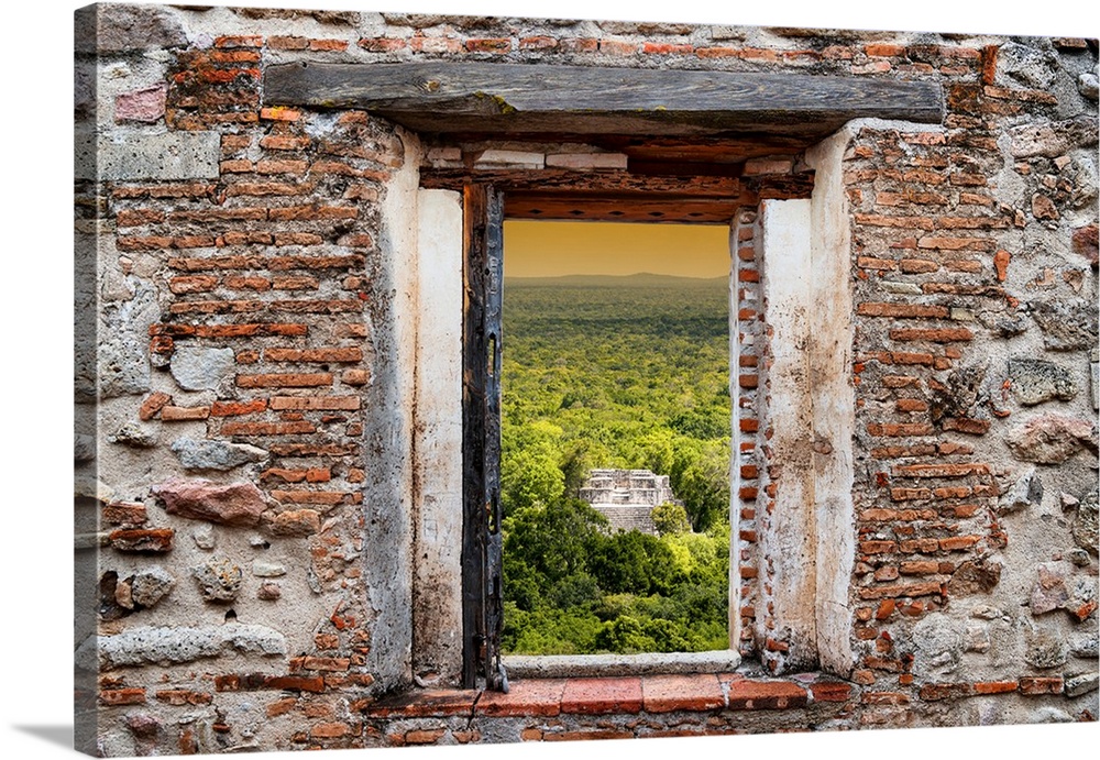 View of the sunset over the ancient Mayan City of Calakmul, Mexico, framed through a stony, brick window. From the Viva Me...