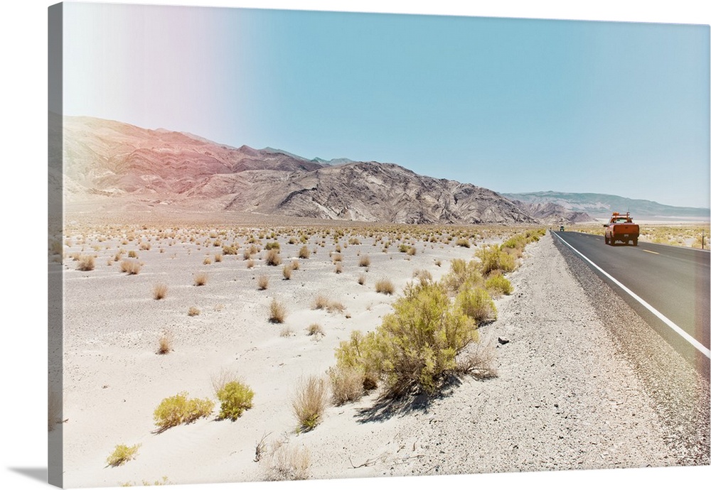 A photograph in soft faded pastel colors of a desert landscape in California.