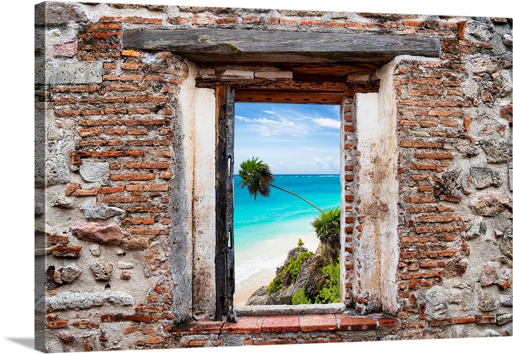 View of the Caribbean coastline framed through a stony, brick window. From the Viva Mexico Window View.