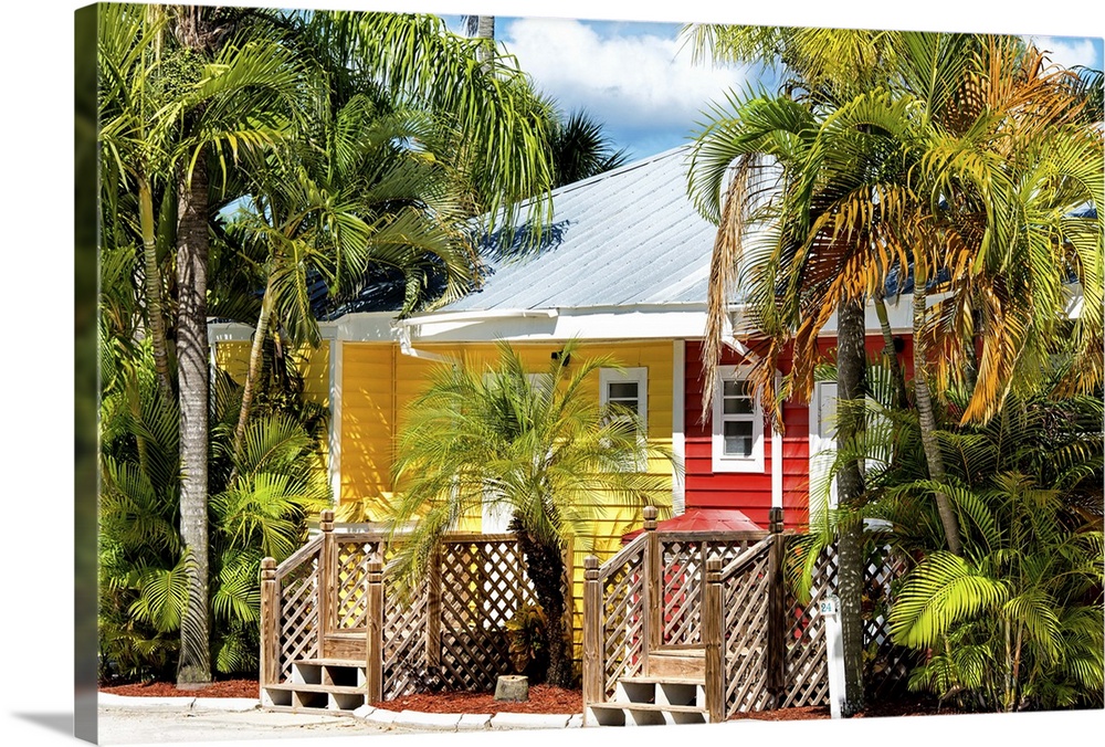 A brightly painted red and yellow house in a Key West neighborhood, Florida.