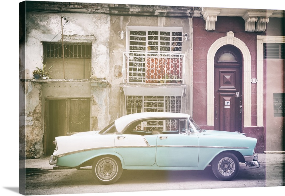 Faded photograph of a turquoise and white vintage card parked on the side of a street in Havana with weathered buildings i...