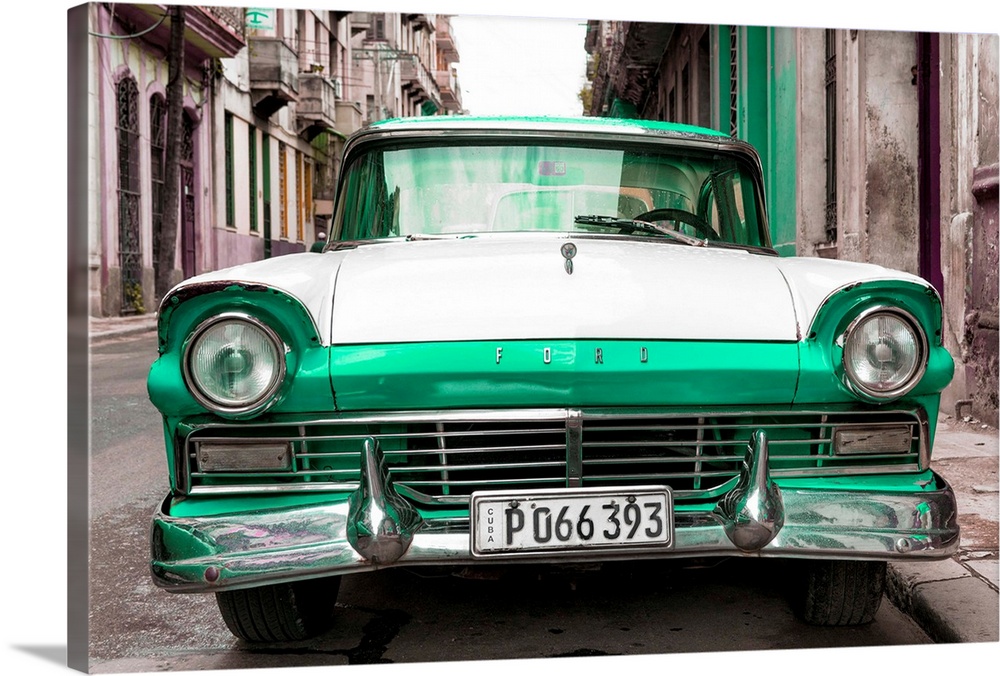 Photograph of a vintage green and white Ford parked in downtown Havana.