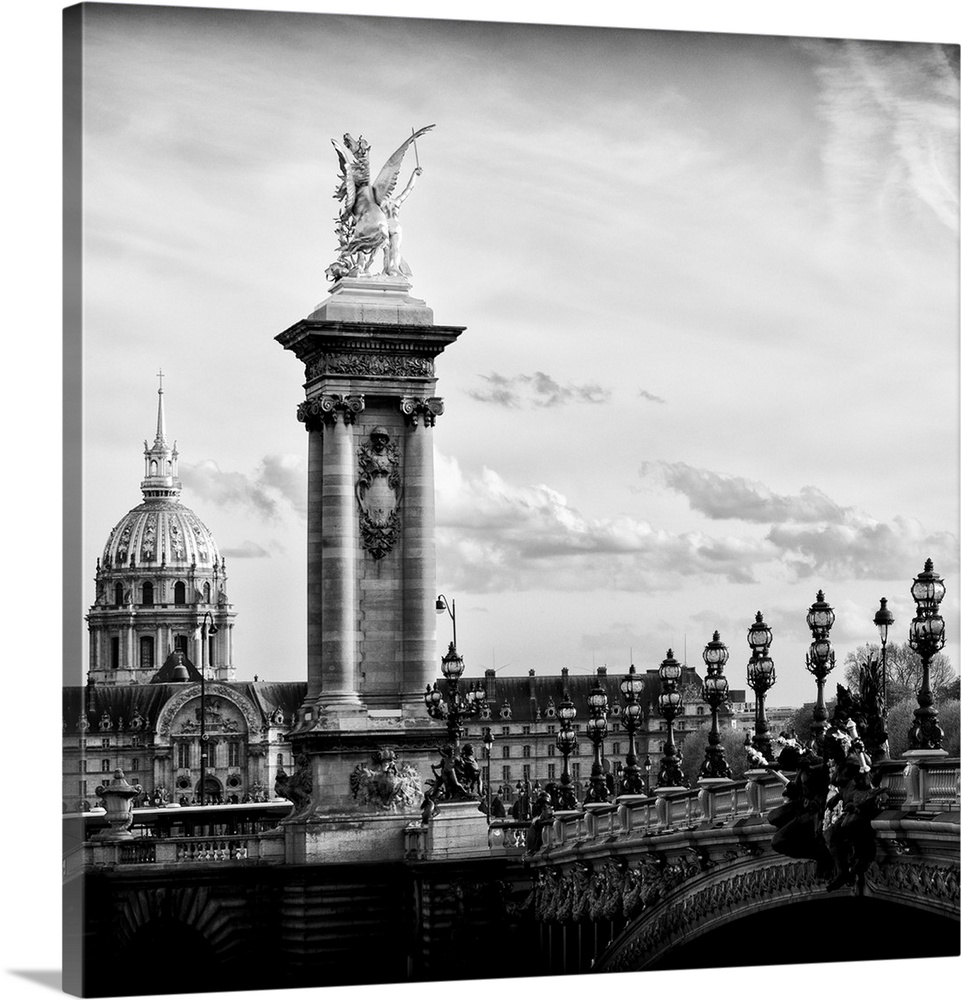 Black and white photo of a statue on the Pont Alexandre III in Paris, France.