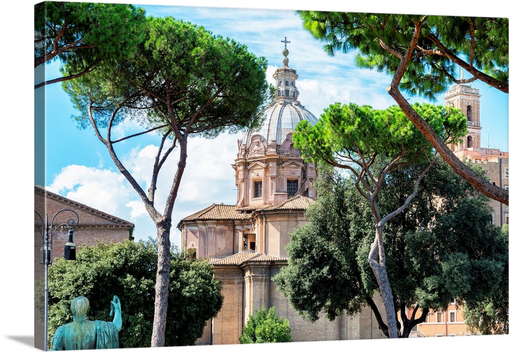 It's a view of a church between the trees in the city center of Rome in Italy.