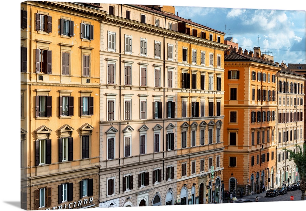 These are buildings with orange facades typical of the city of Rome, Italy.